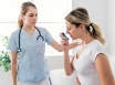 Woman with asthma being treated by a Doctor